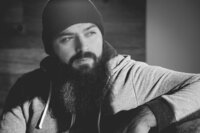 man with beard and hat