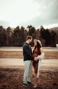 Man holds her wife pregnant in North Park 
