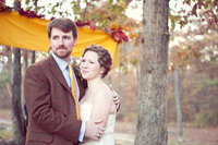 The bride and groom at their fall ceremony in the woods of Bear Creek, Alabama.
