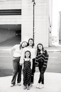 girls posing on road in black and white