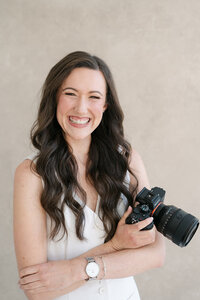 luxury cape cod wedding photographer meghan lynch smiling at the camera