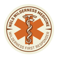 A badge signifying Wilderness First Responder certification from NOLS