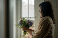Pittsburgh wedding florist Heavenly Blooms putting together a bouquet 