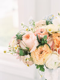 Closeup of blush and light orange bouquet 