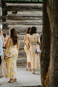 wedding guests dressed in butter yellow tones