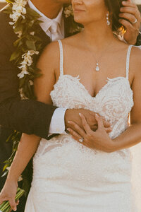 Intimate elopement in McCall Idaho. Couple is kissing lakeside after their ceremony.