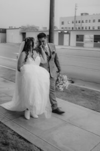A joyful moment of a millennial couple after their wedding ceremony at The Junior League in Bakersfield, California.
