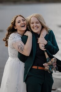 LGBTQ couple embrace during Lake Dillon elopement.