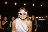 bride in sunglasses at reception