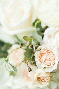 White textured wedding bouquet with greenery crafted by Bouquet Studio and photographed by Loren Jackson Photography at Gervasi Vineyard in Canton Ohio