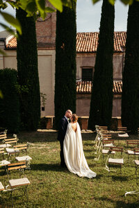 he bride and groom share a heartfelt kiss after the ceremony at the beautiful wedding venue, surrounded by the scenic splendor of Piedmont's Langhe Hills