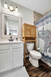 Master bathroom in this three-bedroom, two-bathroom vacation rental house just 5 minutes from The Silos in downtown Waco, TX.