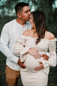 Celebrate the journey to parenthood with a stunning outdoor maternity photoshoot in Connecticut. This heartwarming image captures the love and anticipation of expecting parents in a scenic nature setting. Book your couples maternity photography session with Nicole Mele Photography for timeless and emotional portraits.