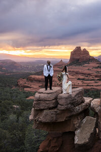 Bride and groom on cliff