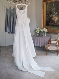 couple of bride and groom stand on stair at chateau de varenne