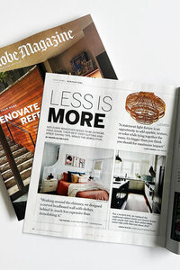 Top interior designers in Boston featured in Boston Globe Magazine. See our modern white kitchen with black island and Allied Maker pendants.