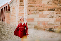 Capture the essence of your senior year against the urban backdrop of Minneapolis and the iconic Stone Arch Bridge. Elevate your portraits with Shannon Kathleen Photography. Book your session now.