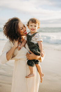 Mother and son portrait shot on the beach in Los Angeles by Marie Buck Photography