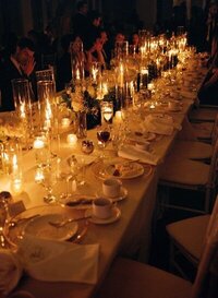 warm dimly lit table scape set up for wedding guests photographed by minnesota photographer tom thornton