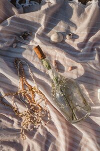 Message in a bottle on beach on blanket great for mockup designs for web design 