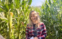 Actor and film producer Cassi Angier in a corn field, representing her roles in the short film Husker. 