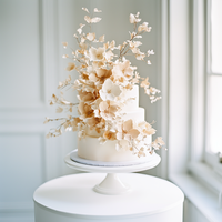 kdurski_86694_a_white_wedding_cake_with_beautiful_beige_and_gol_f10e1196-0006-4448-85eb-29f55aafed84