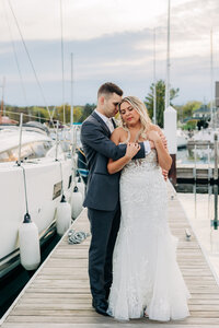 Couple embracing wedding photographer