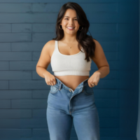 woman wearing old jeans after weight loss