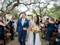 Bride and groom walking down the aisle