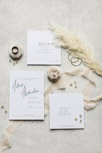 flatlay of wedding invitations