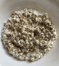 Fruity smoothie with whole blueberries placed on top