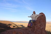 Meg O'Neill standing on a rock in Peru