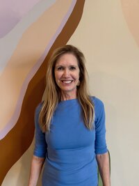 Karen smiling in the yoga studio
