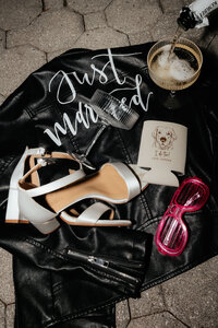 detail shots of brides shoes jacket and sunglasses