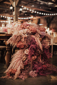 Shades of pink pampas and dried flowers wedding centerpiece