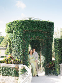 Elegant Miami engagement session at Vizcaya Museum and Gardens, featuring a couple surrounded by timeless architecture and lush gardens.