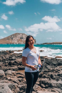 Woman smiling near the ocean, by hawaii individual portrait photographer