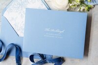 Classic blue wedding invitation envelopes with white ink printing