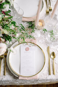 Modern gold and white wedding place settings