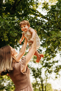 Mother and baby cozy and nursing for motherhood photoshoot