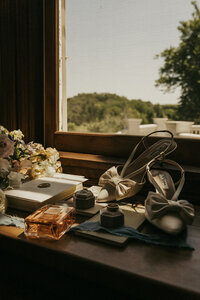 Bridal details sit in windowsill during early morning light