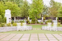 The outdoor courtyard with rocking chairs at the Bradford wedding venue.