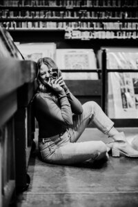 Headshot of a photographer in a record store.