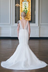 strapless mermaid wedding dress with a petal hem