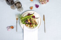 Close up of a plate of food by Wisp & Wild featuring a medley of roasted vegetables and figs