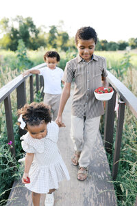 Image of family playing together taken by Sacramento Newborn Photographer Kelsey Krall Photography