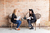 Woman poses for branding in outdoor Asheville location by Tiffany McFalls Photography.