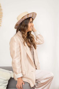 Boutique brand designer presenting visual direction for a modern lifestyle brand.