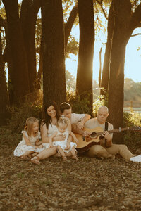 Dreamy golden hour family session with a guitar in Buffalo Gap, TX