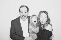 A group of three people make funny faces at the Birdie Booth, an Eugene photo booth rental for weddings and events.